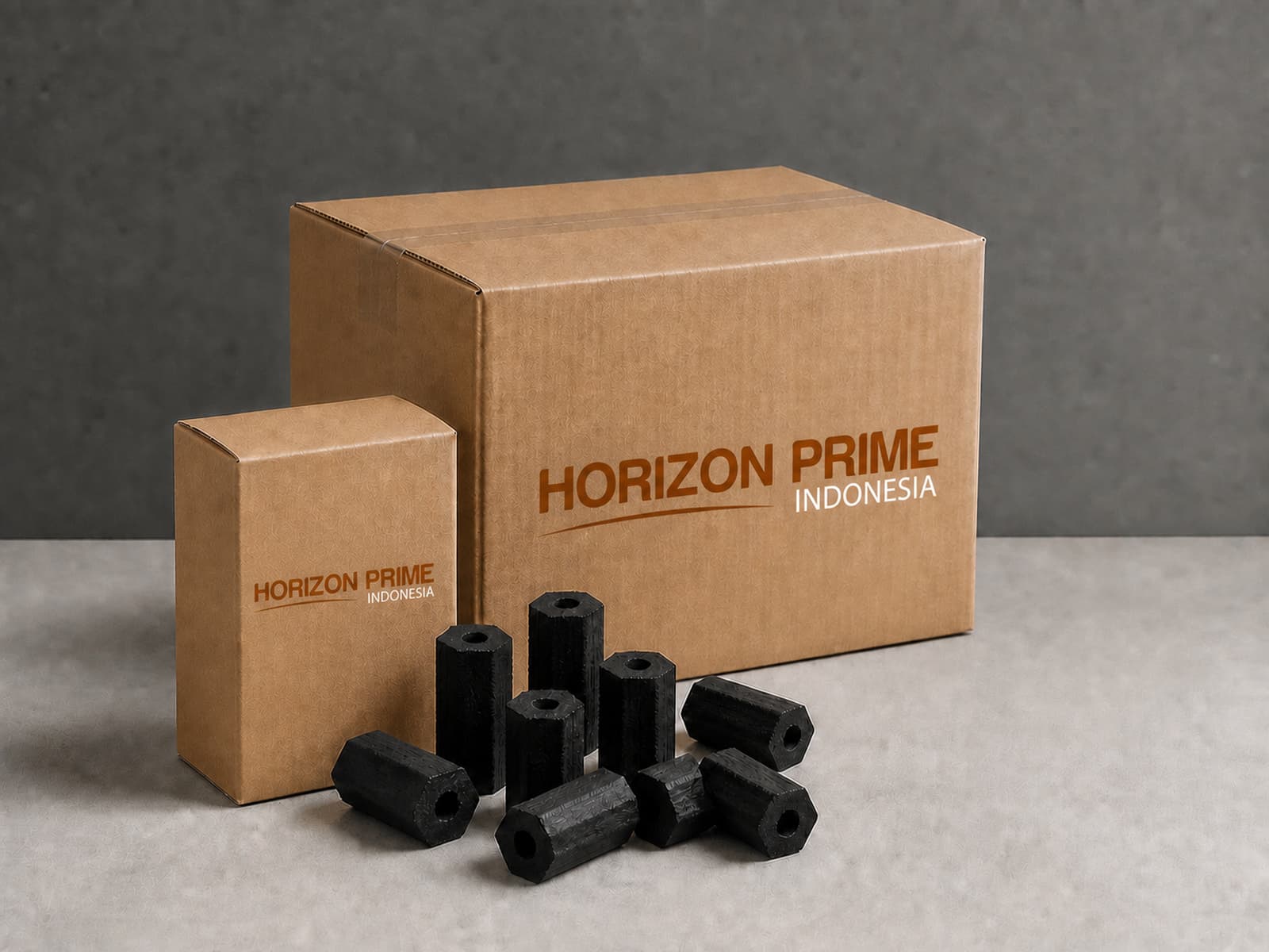 A one-kilogram inner box beside a master carton, with hexagonal coconut charcoal briquettes in front